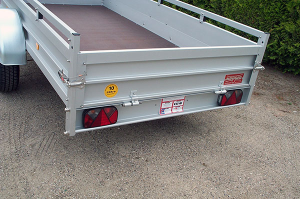 Koch 150.300.13 - Aluanhänger mit Reling, Tempo 100 und 6 Zurrösen, 1300kg, 300x150cm